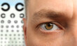 © New Africa - Vision check-up by ophthalmologist. Man and eye chart, selective focus