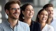 © Kateryna Arkhypova - Diverse group of colleagues laughing together during a business meeting, positive team culture and collaboration concept, defocused background, with copy space