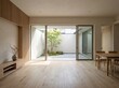 © Jimproz - Interior of a Modern Home with a Minimalist Japanese Garden Courtyard