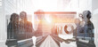 © InfiniteFlow - A group of diverse business professionals engages in data analysis against a backdrop of modern urban architecture, highlighting teamwork and innovation in a vibrant setting. Ledger