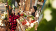 © DC Studio - Female client and vendor drinking cup of hot coffee at farmers market, woman buying fresh eco fruits and veggies. Small business owner selling produce and enjoying visit from regular customer.