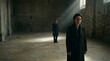 © Nurbaity - Two women standing in a large empty room