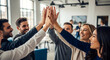 © Rohit - Diverse business team celebrating success with a high five in a modern office