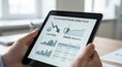 © Justlight - Focused view on a tablet screen displaying a government bonds index fund interface emphasizing low fees and stable returns with blurred portfolio details in the background.