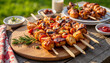 © Valeriy - BBQ skewers arranged on wooden board at twilight, outdoor feast