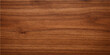 © DAKU MOHARAJ - A detailed shot of a walnut wood surface with rich natural grain, texture, and color. a showcase of natural patterns and the beauty of nature.