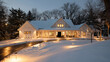 © Saad - A large white house with snow on the roof and ground at dusk