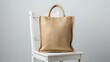 © Mdjohurul - A stylish woven straw tote bag resting on a white wooden chair.