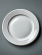© 楠 刘 - Minimalist empty white ceramic plate in top-down view with soft neutral lighting on dark background, clean simple composition, modern elegant tabletop design