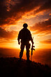 © Acrdesign - Soldier silhouette holding rifle on hilltop at fiery sunset
