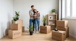 © thenort - Couple embraces in empty room, surrounded by moving boxes and potted plants