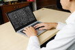 © InfiniteFlow - Mathematic equations and modish formula on computer screen showing concept of science and education
