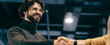 © Prostock-studio - Two people meet in a modern office environment. They exchange a handshake which signifies a business agreement. The atmosphere is professional and focused on collaboration.