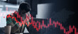 © Prostock-studio - A person sits at a desk looking stressed while working on a laptop. Graphs and charts appear on the screen, showing market trends and changes in stock prices.