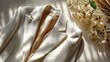 © MopoWe - White luxury blazer with elegant textured fabric and silk lining rests on a bright surface with natural sunlight shadows and flowers for sophisticated fashion concepts