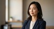 © Tapan - Asian woman in business attire.