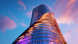 © Somporn Na Ubon - Futuristic skyscraper with unique design, showcasing modern architecture and vibrant colors against sunset sky