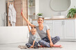 © Pixel-Shot - Happy mother and her little daughter with toothbrushes in bathroom