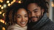 © Enggal Pitoyo - Close-up portrait of a smiling young couple.  Festive bokeh background