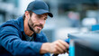© Aliaksandra - HVAC technician repairing an outdoor air conditioning unit on a rooftop with focused precision