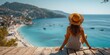 © Alexander LW - Happy female tourist in hat relaxing and enjoying on beach, young lonely traveler looking at beautiful sea view