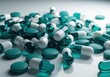 © Shahanara - Assorted teal and white medical capsules and pills