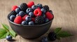 © Ahmad - A dark bowl overflows with vibrant blueberries, raspberries, and blackberries