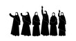 © Nira - Diverse Group of Women in Black Hijabs Raising Hands in Unity and Empowerment