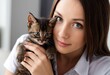 © RYOTA IWASAKI - Portrait of a young woman holding a cute kitten