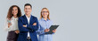 © Pixel-Shot - Portrait of business people on grey background
