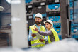 © Halfpoint - Industrial team evaluate the production process in high tech manufacturing plant.