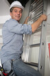 © auremar - mature workman on a stepladder