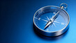 © Mamer - Classic blue compass guiding exploration and discovery on a reflective surface