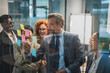 © Miljan Živković - Diverse business team collaborating during brainstorming session