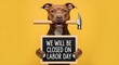 © MDAzizul - A brown dog holding a hammer in its mouth and a chalkboard sign that says we will be closed on labor day against a solid yellow background