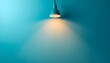 © Asif - A blue wall with a single hanging lamp casting a warm glow