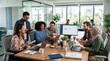 © Cealv - A diverse business team collaborates dynamically around a table in a bright, modern open-plan office.