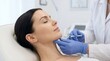 © Eve - Facial injection for chin contouring. Cosmetic surgeon performing beauty treatment with syringe to woman face. Aesthetic medicine, filler injection, anti-aging and skincare concept.