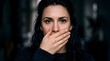 © Obbinokes - Portrait of a woman covering her mouth with hands, demonstrating the speak no evil gesture. Conceptual image about silence, censorship, secrets, and suppression of voice in modern society.