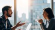 © Lynchsz - Professional colleagues engaged in a focused business discussion, sharing ideas and collaborating in a bright modern office environment