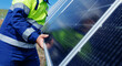 © Parilov - Worker on solar panel installation in outdoor renewable energy setup, eco energy efficiency
