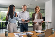 © Nenad - Group of business professionals in a productive discussion at a conference meeting
