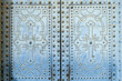 © Julien McRoberts - Pale blue studded ornamental door pattern