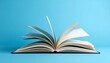 © Sadia - Open Hardcover Book with Pages Spread Out in a Fan Shape Isolated on a Solid Blue Background Representing Education Knowledge and Literature
