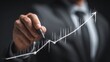 © Fexri - Process improvement concept showing a businessman drawing a rising line symbolizing continuous growth and improvement.