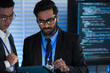© ultramansk - AI research team huddles late night innovators review complex machine learning model architecture discuss training data using tablet stylus futuristic lab code screens glow bright.