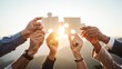© Amala - Team Building Concept with Wooden Jigsaw Pieces at Sunset