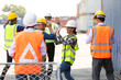 © NVB Stocker - engineering and worker Soccer football players competing for ball kick ball during match in container yard.