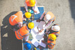 © NVB Stocker - Ethnic diversity worker people, Success teamwork. Group of professional engineering people wearing hardhat safety helmet meeting with solar photovoltaic panels discussion in new project