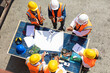 © NVB Stocker - Ethnic diversity worker people, Success teamwork. Group of professional engineering people wearing hardhat safety helmet meeting with solar photovoltaic panels discussion in new project